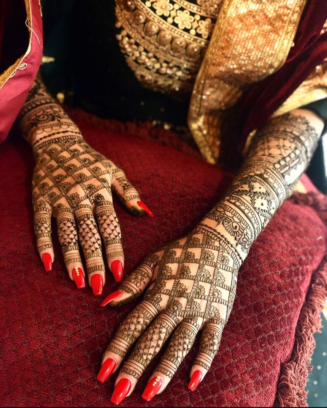 Henna artist creating intricate design